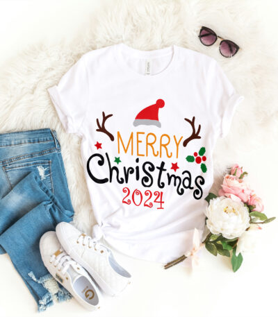 a white shirt with a text on it and jeans and sunglasses merry Christmas 2024